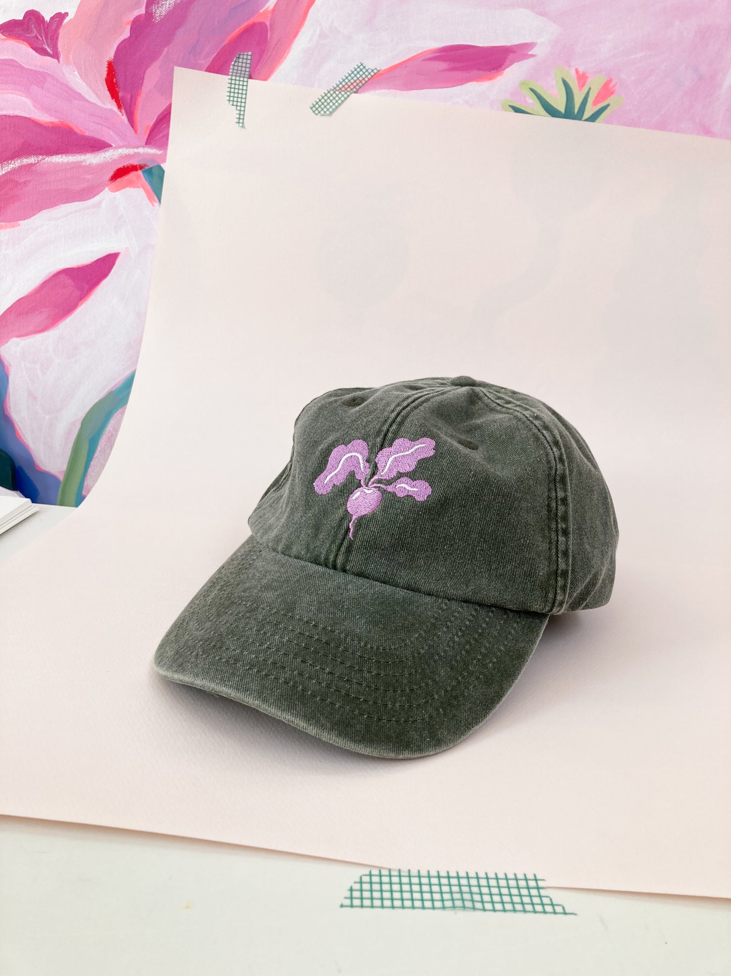 Olive green washed cap with pink radish embroidery by Sophie Potter